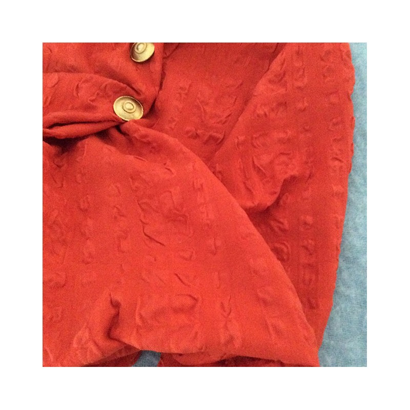 Tissu cloqué laine et coton orange capucine à relief gaufré infroissable pour veste et rideaux